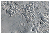 Layered Material in a Crater in Arabia Terra