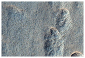Incipient Scalloped Terrain in Mid-Latitude Mantle at Peneus Patera