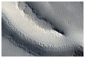 Channels and Troughs in Southwestern Elysium Rise