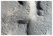 Channel and Possible Deposit in Cerulli Crater in Deuteronilus Mensae