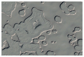 Small Fan-Like Features on Perennial Cap