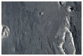 Teardrop-Shaped Outcrop around Impact Crater