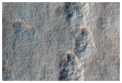 Incipient Scalloped Terrain in Mantle at Peneus Patera