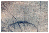 Peak of Possible Remnant Highlands Volcano in Sisyphi Planum