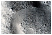 Channels in Rim of Crater within Cassini Crater