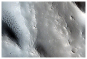 Ejecta Falling Into Earlier Large Crater