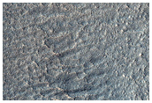 Massifs and Aprons in Promethei Terra