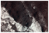 Circular Feature within South Polar Layered Terrain Scarp
