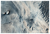 Differential Erosion of Light-Toned Stratigraphy in Melas Chasma