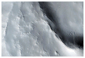 Ejecta Falling Into Earlier Large Crater