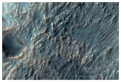 Crater with Possible Phyllosilicates in Ejecta Northwest of Hellas Planitia