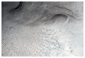 Relatively Fresh 1 Kilometer Diameter Crater in South Polar Region 