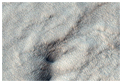 Pit with Layered Walls in Mid-Latitude Mantling Unit