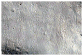 Well-Preserved 12 Kilometer Impact Crater on East Rim in Isidis Region