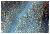 Tongue-Shaped Features within Alcoves on South Mid-Latitude Crater Wall
