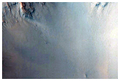 Possible Impact into Altered Bedrock Exposed within Libya Montes Massif