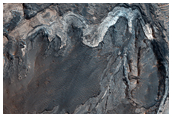Light-Toned Units along the Wallrock and Floor of Melas Region