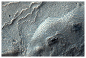 Material Mantling South Slope in MOC Images R11-03121 and S14-01956