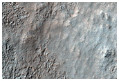 Exposures of Layered Bedrock North of Hellas Basin