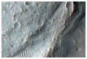 Banded Terminus of Lobate Feature Northwest of Oudemans Crater
