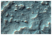 Small Light Toned Streak in Small Crater
