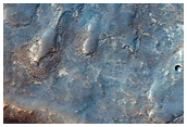 Light-Toned Layering in Plains South of Melas Chasma