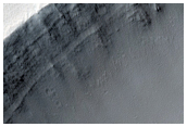 Crater with Rampart-Like Ejecta Exposed in Cross Section