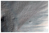 Light-Toned Feature on Crater Wall in CTX Image