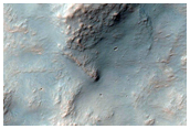Exposures of Layered Bedrock North of Hellas Basin