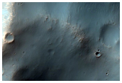 Bright Outcrops on Degraded Columbus Crater Rim