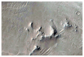 Well-Preserved 7-Kilometer Diameter Crater within Isidis Planitia