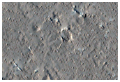 Little Bumps with Very Regular Spacing Outside Tooting Crater Flow Lobe