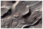 Fractured Layered Materials North of Argyre Region Southwest of Hale Crater