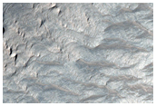 High Thermal Inertia Material in Wall of Tithonium Chasma