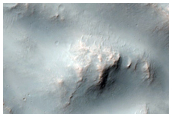 Distal Rampart of Layered Ejecta from a Fresh Crater