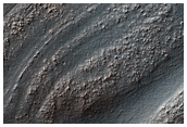 Strati di sedimenti deformati nella parte Ovest dellHellas Planitia