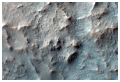 Central Uplift and Olivine-Rich Ponded Material in Elorza Crater