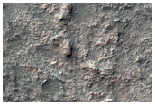 Layered Bedrock in Shallow Crater Northeast of Hellas Planitia
