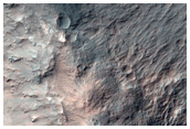 Outcrops of Light-Toned Materials Exposed in Highlands Crater Wall