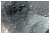 Crater Containing Mantle Material and Ridges