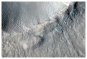 Crater with Sharp Rim and Elongated Secondaries