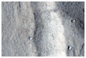 Degradation of Old Crater Rim on Northwest Slope of Acheron Fossae