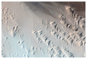 Crater with Wind Streak Northwest of Ascraeus Mons
