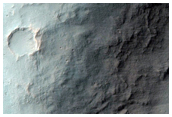 Ejecta of Crater Sectioned by Erosion