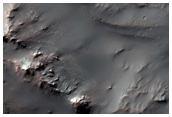 Well-Preserved 15-Kilometer Impact Crater Northwest of Hellas Planitia