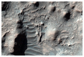 Remnant Mantling Deposit in Millochau Crater