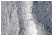 Degradation of Old Crater Rim on Northwest Slope of Acheron Fossae