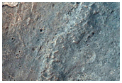 Light-Toned Layered Rock in Trough on Plain South of Melas Chasma