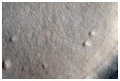 Thermally Distinct Crater in Arcadia Dorsa