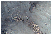 Hummocky and Collapsed Terrain Contact on Western Arsia Mons